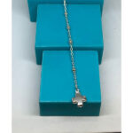 denario con cruz de puntera