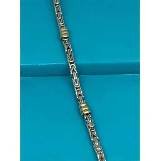 eslabon artesanal con oro 18 kts