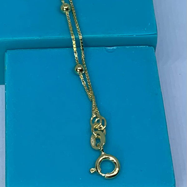 Dorada doble  con bolitas